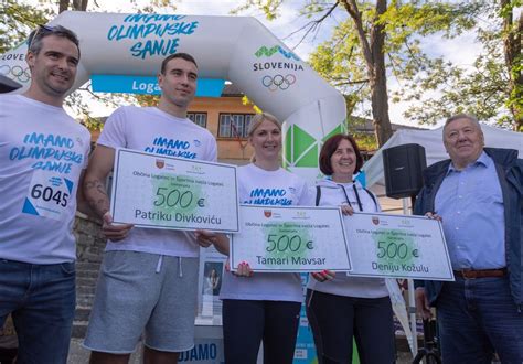 Slovenska bakla s simboli olimpijskih iger in slovenske dediščine