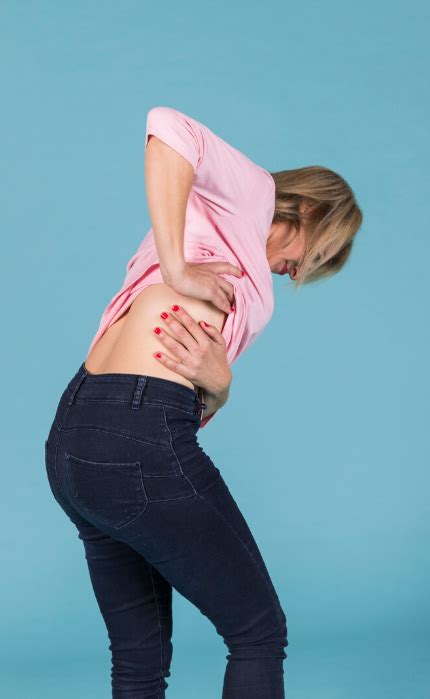 Ženska z bolečinami v medenici