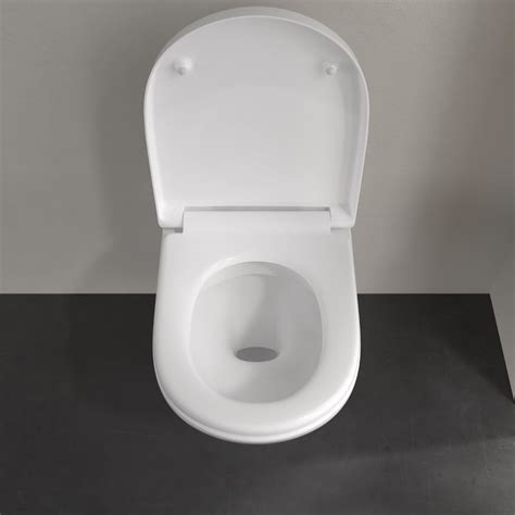 WC školjka z zaprtim pokrovom in WC nastavek za otroke