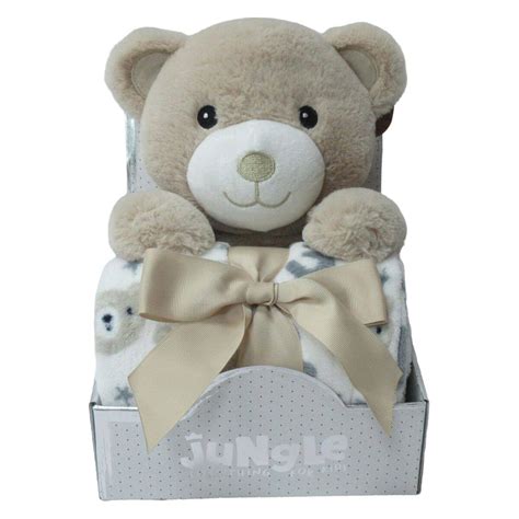 Novorojenček v posteljici s plišastim medvedkom