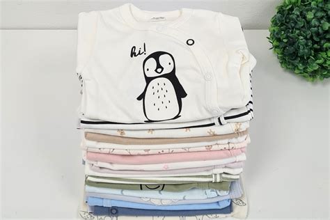 Različni tipi bodijev za novorojenčka