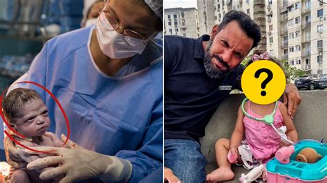 Dojenček z bolečim izrazom na obrazu, ki se zvija