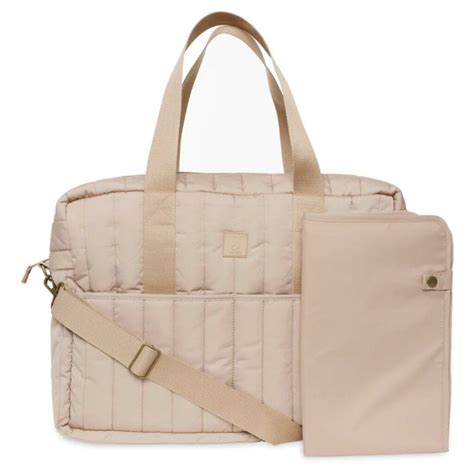 Stokke previjalna torba pritrjena na otroški voziček