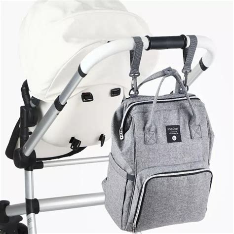 modna previjalna torba na otroškem vozičku