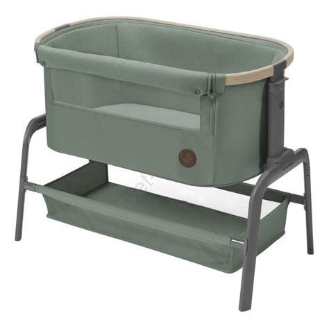 zelena potovalna posteljica z mrežastimi stranicami