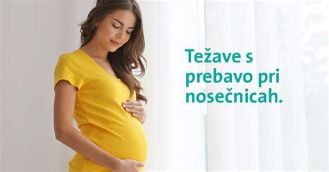 Ženska v 13. tednu nosečnosti, ki drži trebuh