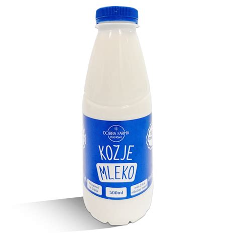 Kozje mleko v steklenici s kozami v ozadju